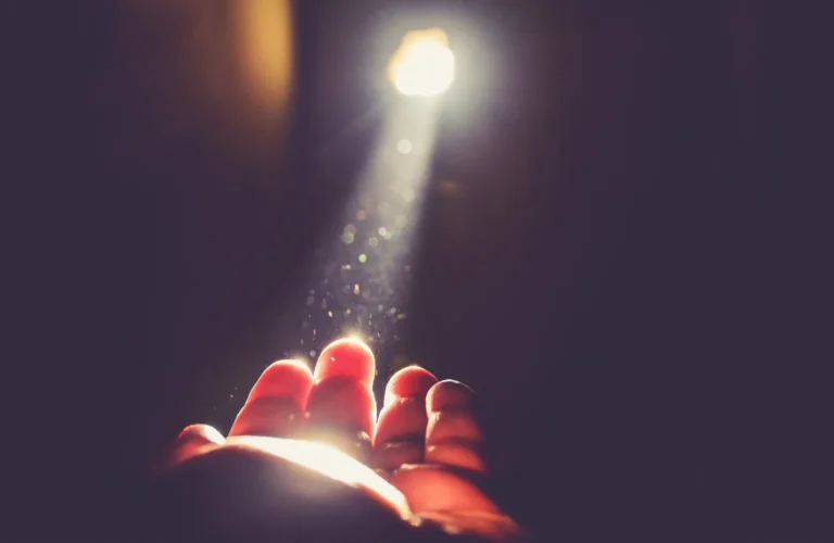 A person holding a light bulb, symbolizing ideas and inspiration, alongside a theme of meaningful quotes.