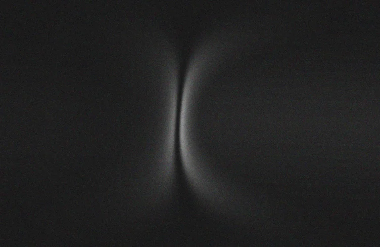 Black and white photograph of a black object, representing deep, thought-provoking quotes that stay with you.